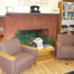 Buckland Public Library: interior view of casual seating by the fireplace