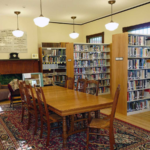 Buckland Public Library: interior seating area, tables, and bookcases