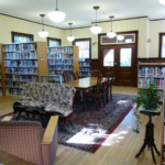Buckland Public Library: interior view of casual seating area and bookcases